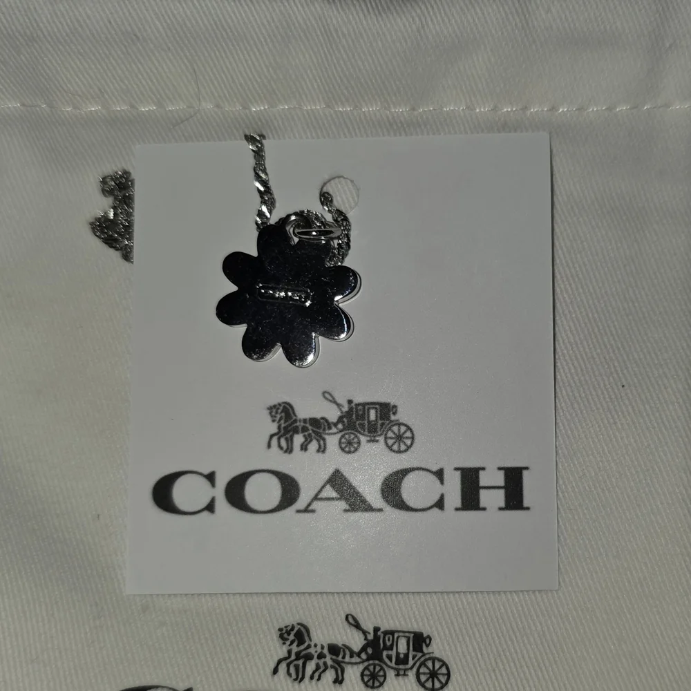 COACH Silver And Orange Daisy Pendant Necklace - Picture 3 of 6